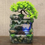 Fontaine d'intérieur zen avec rochers et arbre décoratif